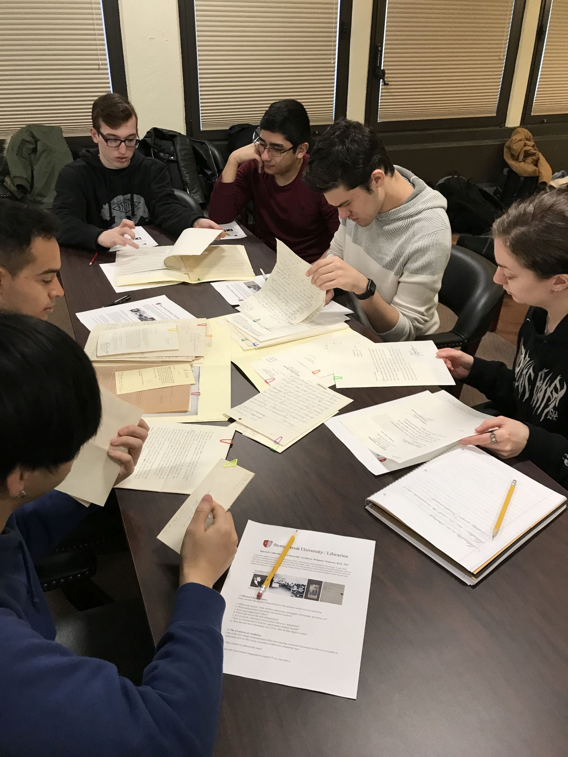 Students examining documents