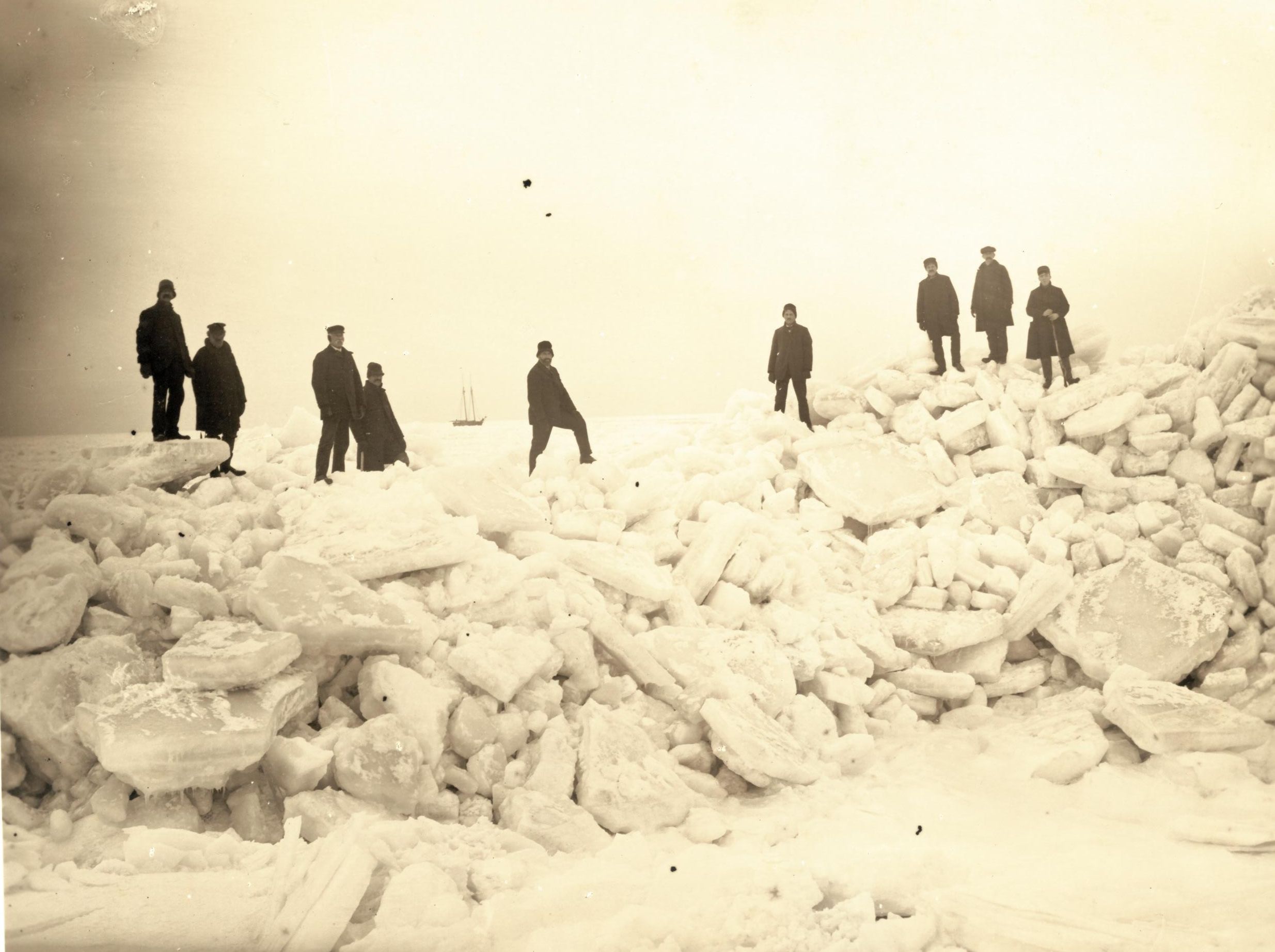 Men standing on ice in the Long Island Sound by Old Field Point, New York, February 2, 1902. Photograph by Byron W. Hallock.